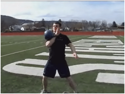 Man doing kettlebell exercise in the ground. 