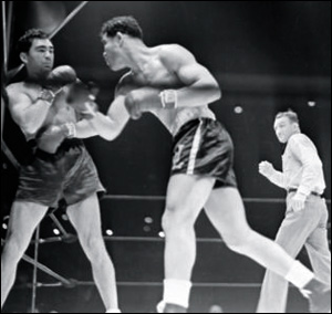 Vintage Joe Louis and Max Schmeling fighting in boxing match.