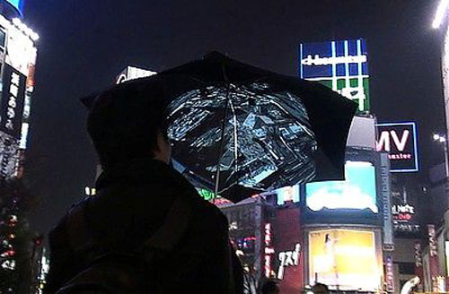 Wifi camera umbrella taking picture at night.