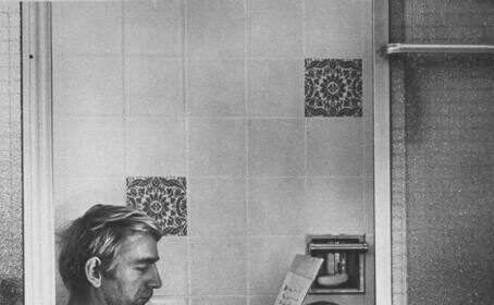 A man creating a guide in a bathtub.