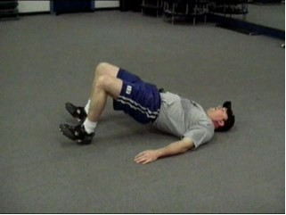 A man doing exercise for hip extension and hip abduction. 