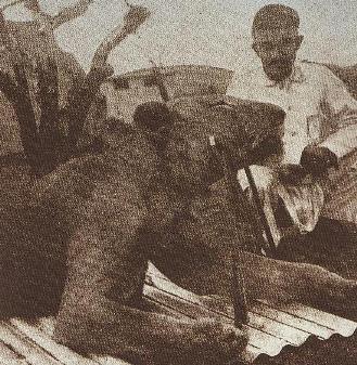 Vintage illustration of a lion sitting with man.