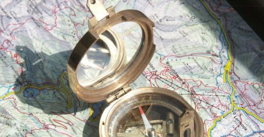 A map with a compass for finding north.