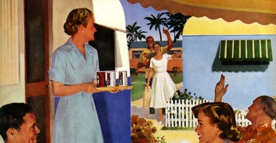 A group of people sitting at a table enjoying beer during summertime.