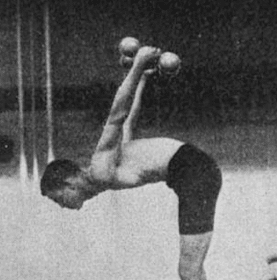 An old photo of a young man lifting weights.