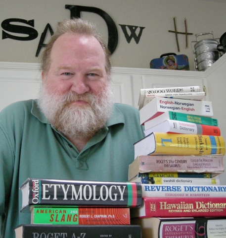 Mark Gunnion posing with his book's collection.