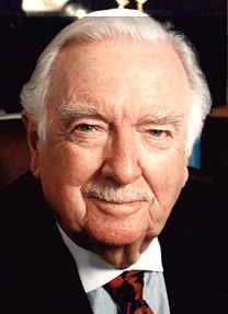 Walter Cronkite posing with white mustache.