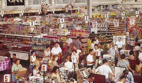 A crowd of restless people in a grocery store, limited by social distancing measures.