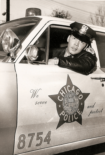 A police officer in a patrol car.