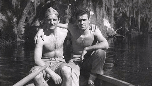 Two manly men in a boat, displaying their loyalty.