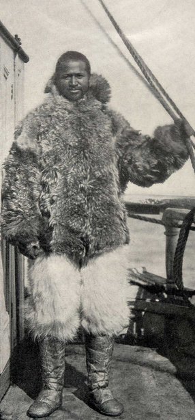 Matthew Henson posing in fur coat and pants.