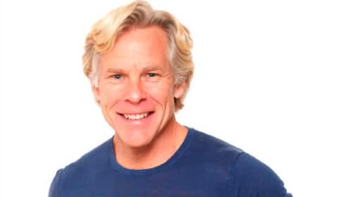 A man with blond hair and a blue shirt, possibly following Primal Living.