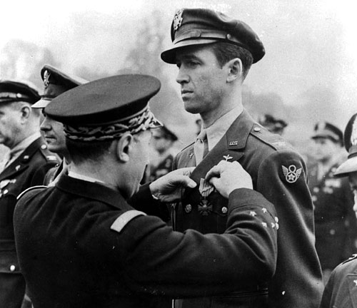 Jimmy Stewart getting medal pinned on ceremony.