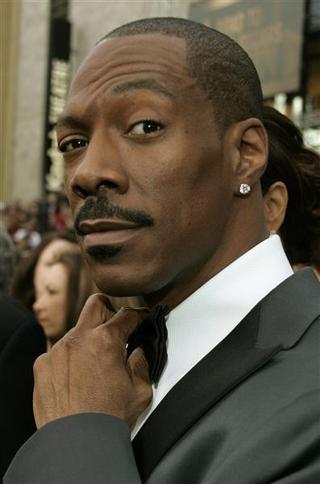 Eddie Murphy posing with mustache.