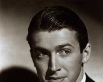 A black and white photo of a man in a tuxedo exudes elegance and sophistication.