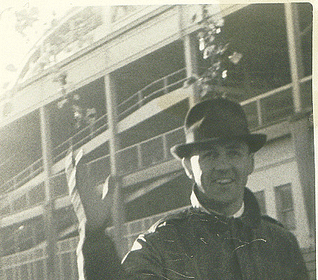 A man wearing a hat, surrounded by the right kind of people.
