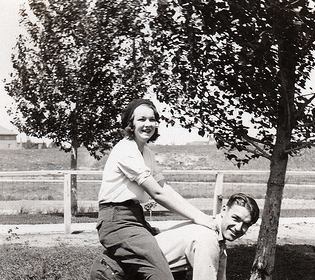 A man and a woman on a horse, showcasing a perfect balance of masculinity and femininity.
