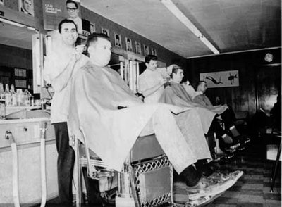 Vintage men cutting hair in barbershop.