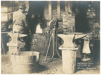 Vintage blacksmith doing his work in the shop.