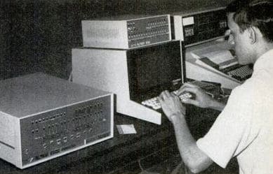 Vintage man using old computer first computing machines.