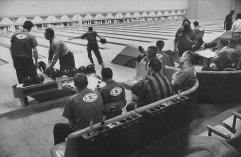 Vintage 1950s bowling alley league play.