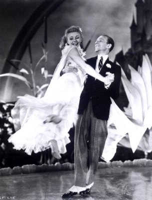 Ginger Rogers and Fred Astaire performing stage dance.