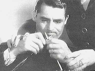 Vintage Cary Grant doing knitting.