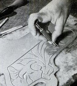 Vintage man doing leatherwork.