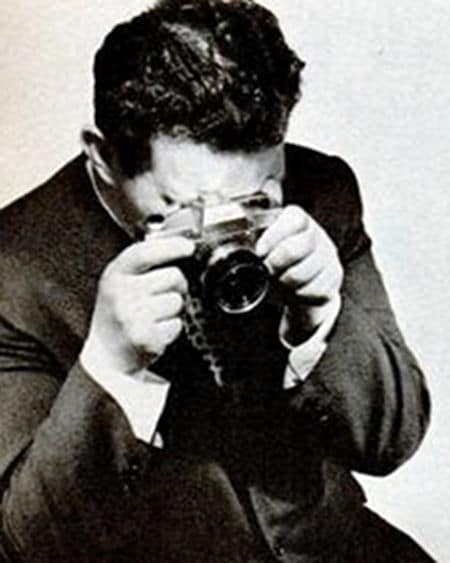 Vintage man taking photo by camera.