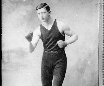 Description: A rediscovered photograph of a man in boxing gear, showcasing his passion for exercise.