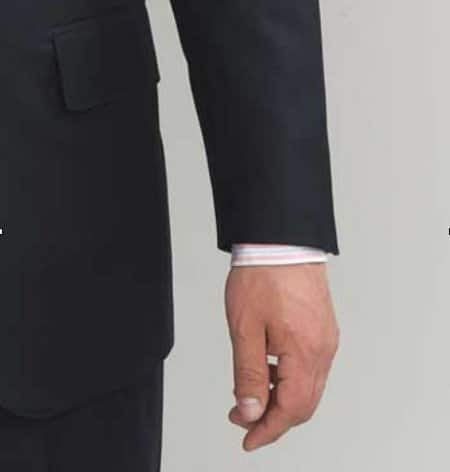 Man wearing shortened sleeve suit.