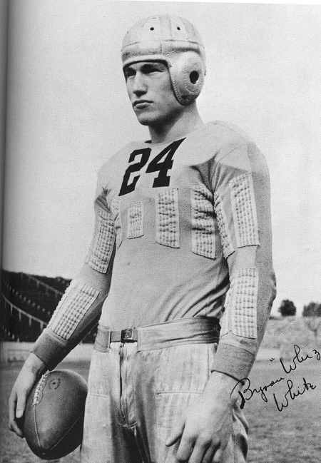 Byron Whizzer standing in football kit.