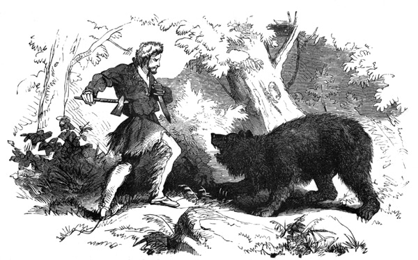 A man stands next to a bear in the woods during a Wild West adventure.