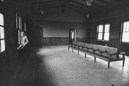 A vintage black and white photo of a nostalgic waiting room.