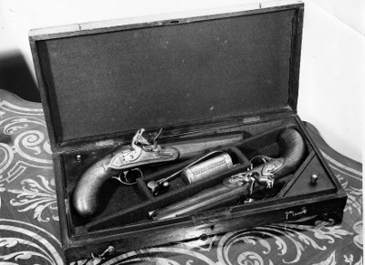 Vintage pair of pistols placed in box. 