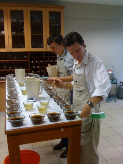 Mark Inman coffee buyer tasting product samples.