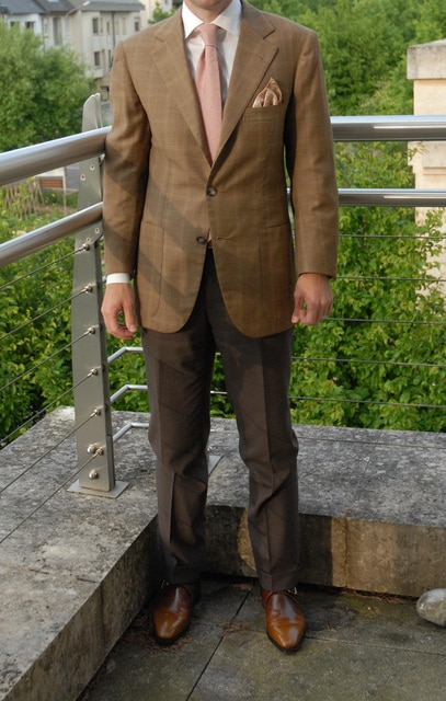 Man wearing a brown suit.