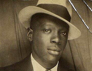 A man wearing a men's hat.