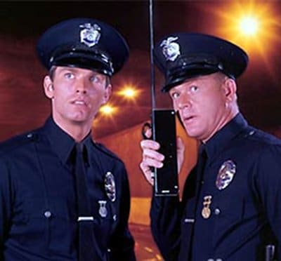 Adam-12 dragnet spinoff classic cop detective tv show patrol officers holding wireless.