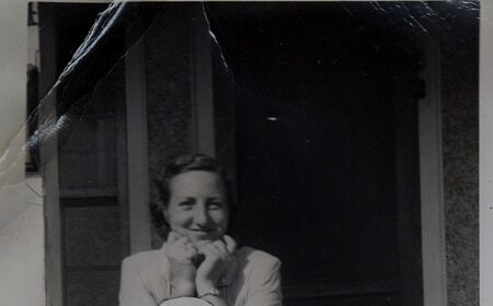 A black and white photo of a family posing for a picture, capturing the bittersweet moments after their recent loss.