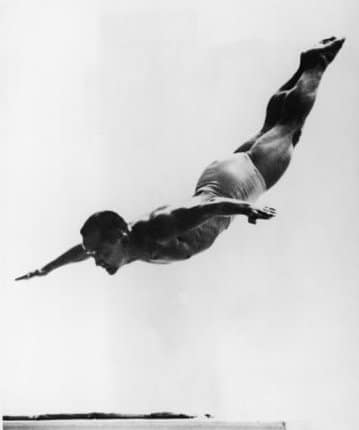 Sammy Lee Olympic diver action while doing swan dive.