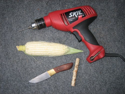 DIYof corn cob pipe supplies like drill, knife,corn cob and stick.