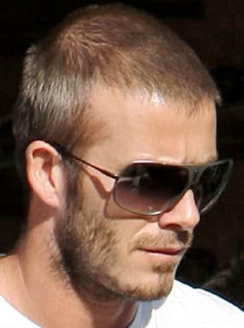 David beckham with sun glasses and short hair.