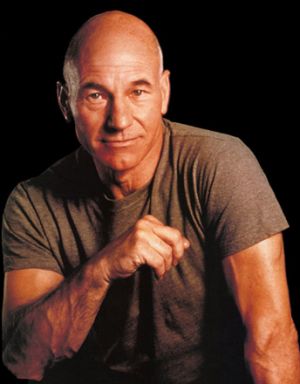 Patrick Stewart portrait posing with t-shirt bald head.