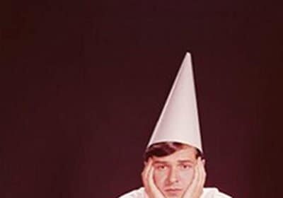 A man wearing a cone hat, showcasing the essence of