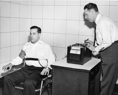 Vintage man taking lie detector test.