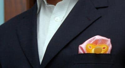 Pacifier with pocket square in suit jacket.
