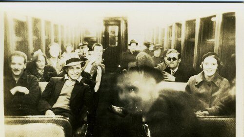 A group of people sitting on a train, displaying their personal influence.