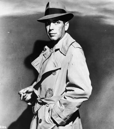 Humphrey Bogart double breasted trench coat and hat.