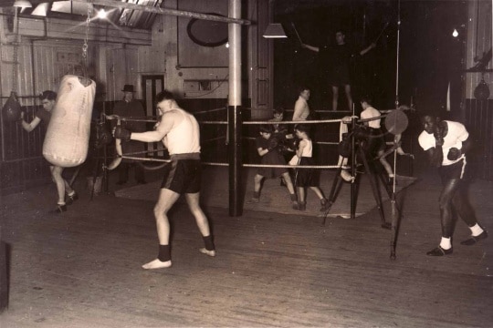 Boxers practicing the boxing in the gym.